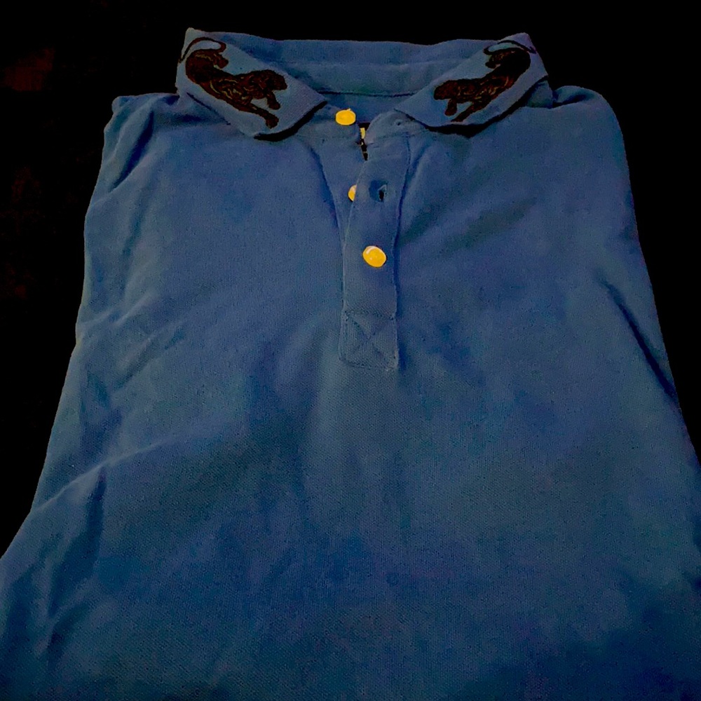 Standard issue royal blue shirt with lions on the collar